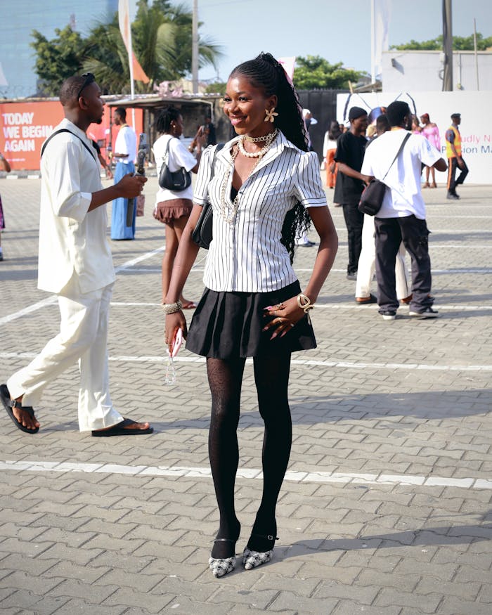 Chi siamo Fashionable individuals at an outdoor event showcasing diverse styles and trends.